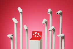 A conceptual image of CCTV cameras spying on a laptop computer with message bubbles.